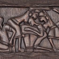 This authentic Haitian wood carving captures a powerful Vodou ceremonial scene, where figures move in unison through ritual, rhythm, and spiritual devotion. The composition reflects the deep connection between community, ancestors, and sacred traditions that define Haitian Vodou culture.