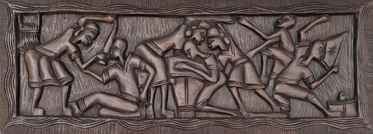 This authentic Haitian wood carving captures a powerful Vodou ceremonial scene, where figures move in unison through ritual, rhythm, and spiritual devotion. The composition reflects the deep connection between community, ancestors, and sacred traditions that define Haitian Vodou culture.